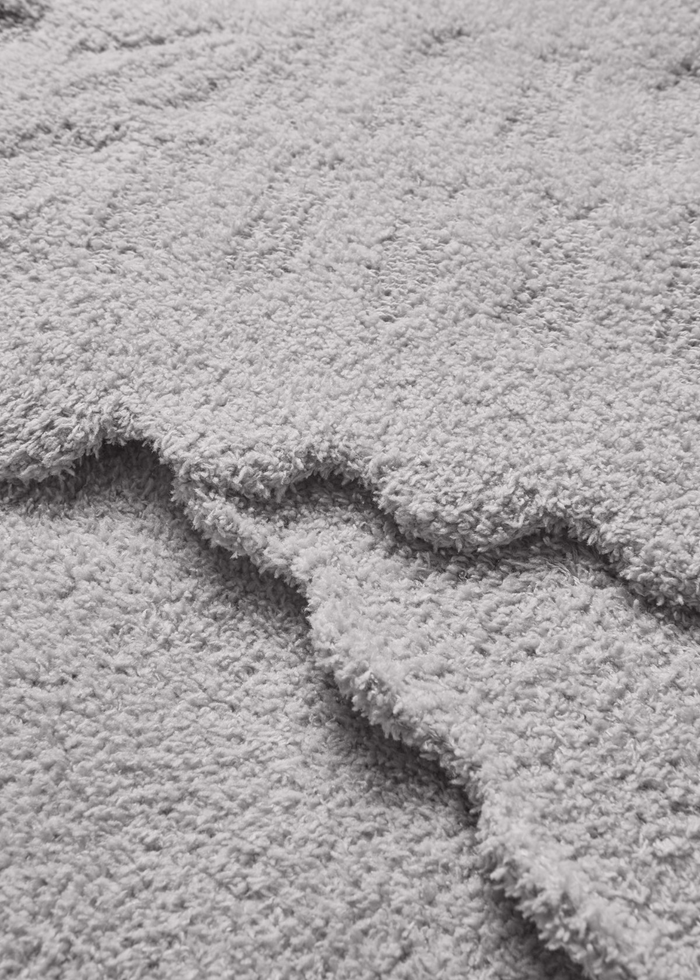 Grey blanket with scallop edges
