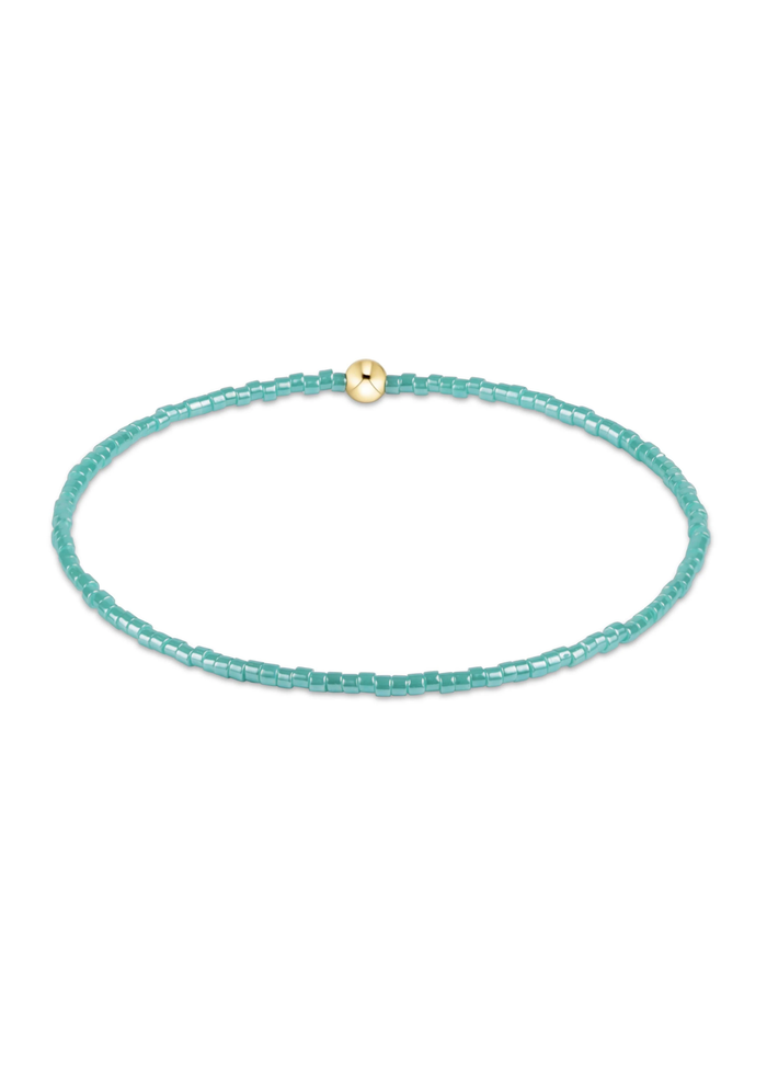 Blue beaded bracelet on a white background