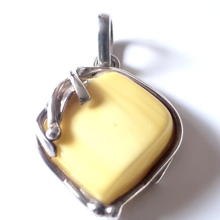 genuine light yellow butterscotch amber pendant in sterling silver frame