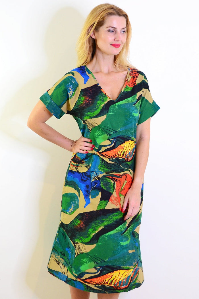 Green and orange playful tunic dress by Hourglass, featuring a relaxed fit and vibrant color-block design.