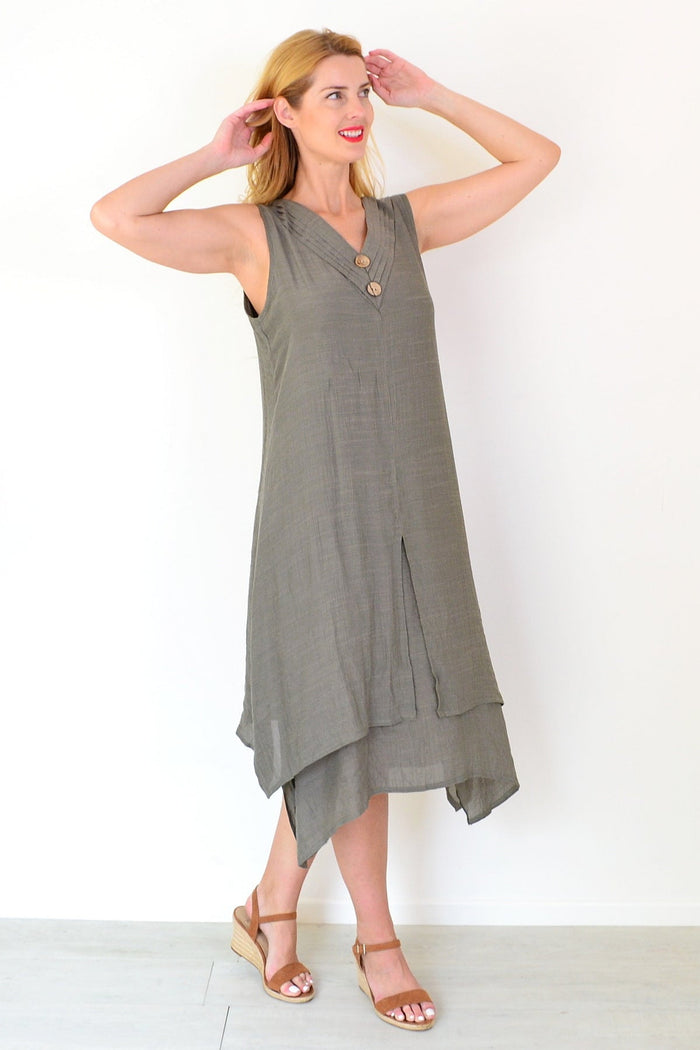 Khaki sleeveless coconut button tunic dress by La Mode with a relaxed fit and side pockets, displayed on a mannequin.