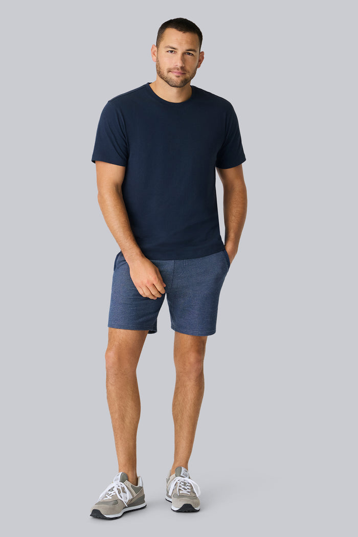 Full front view of a man wearing Linen Jersey Crew Neck T-shirt in Total Eclipse