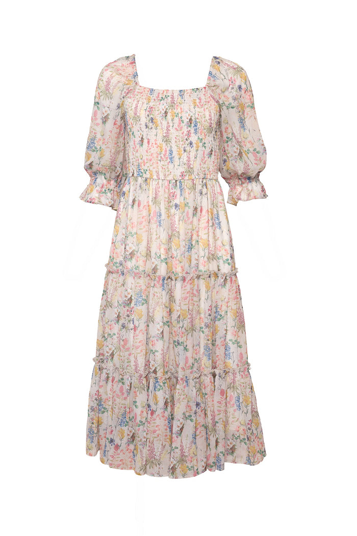 The Ivy City Co Madeline Dress in Cordelia Floral features a light, knee-length silhouette with a square neckline, puffed half sleeves, a tiered skirt, and a white fabric adorned with delicate pastel multicolored floral print.