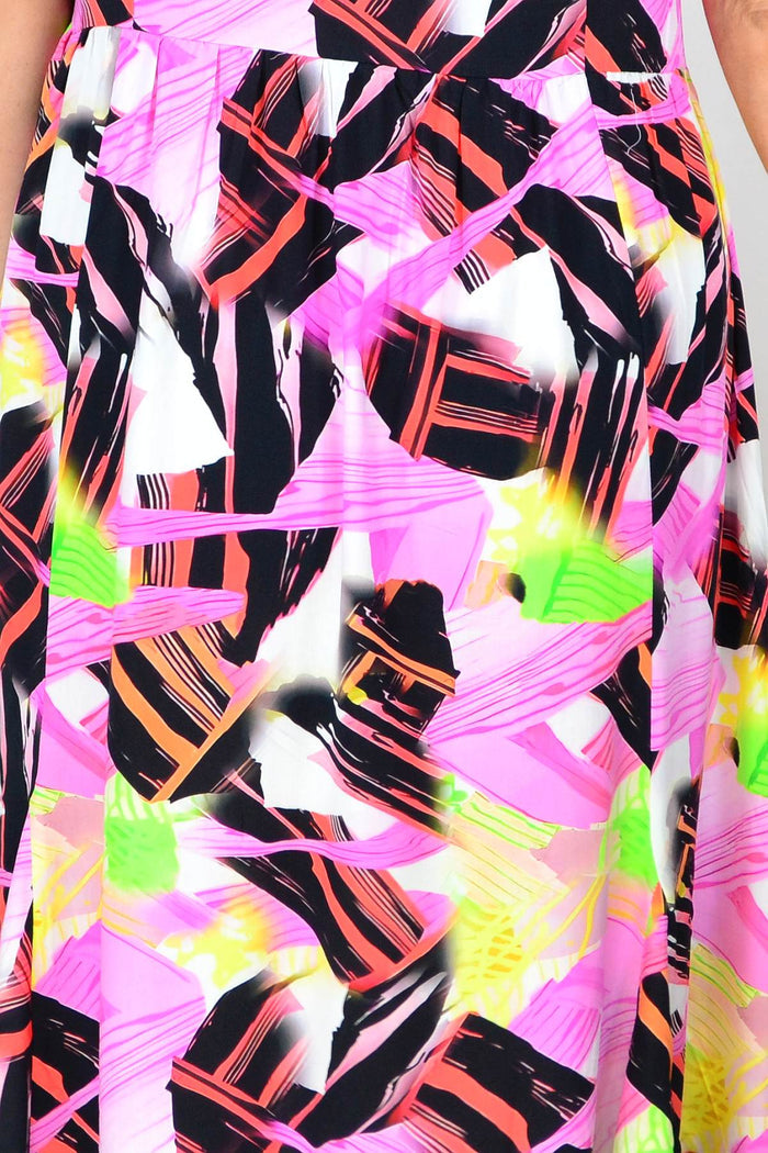 Pink and black abstract tunic dress by Hourglass, featuring a stylish loose fit and modern design, shown on a model.