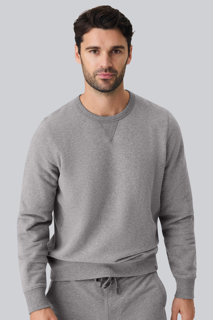 Front view of a man wearing ACE Crew Neck Sweatshirt in Grey Heather