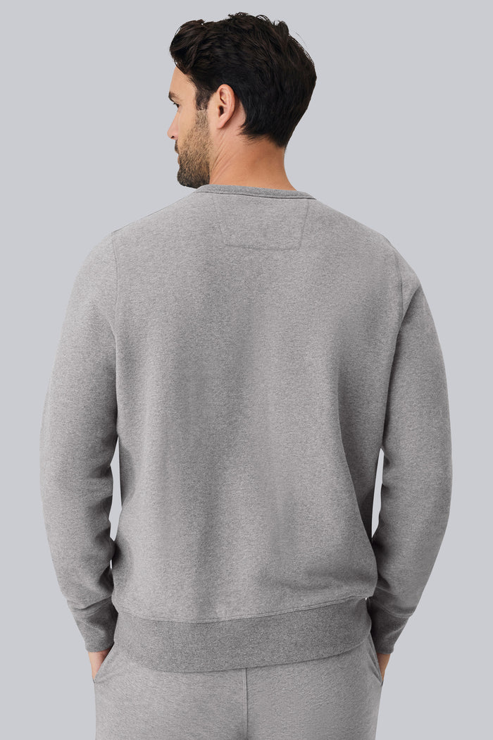 Back view of a man wearing ACE Crew Neck Sweatshirt in Grey Heather