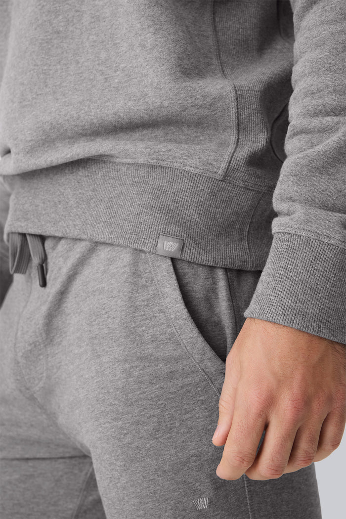 Mack Weldon logo on the waist hem of ACE Crew Neck Sweatshirt in Grey Heather