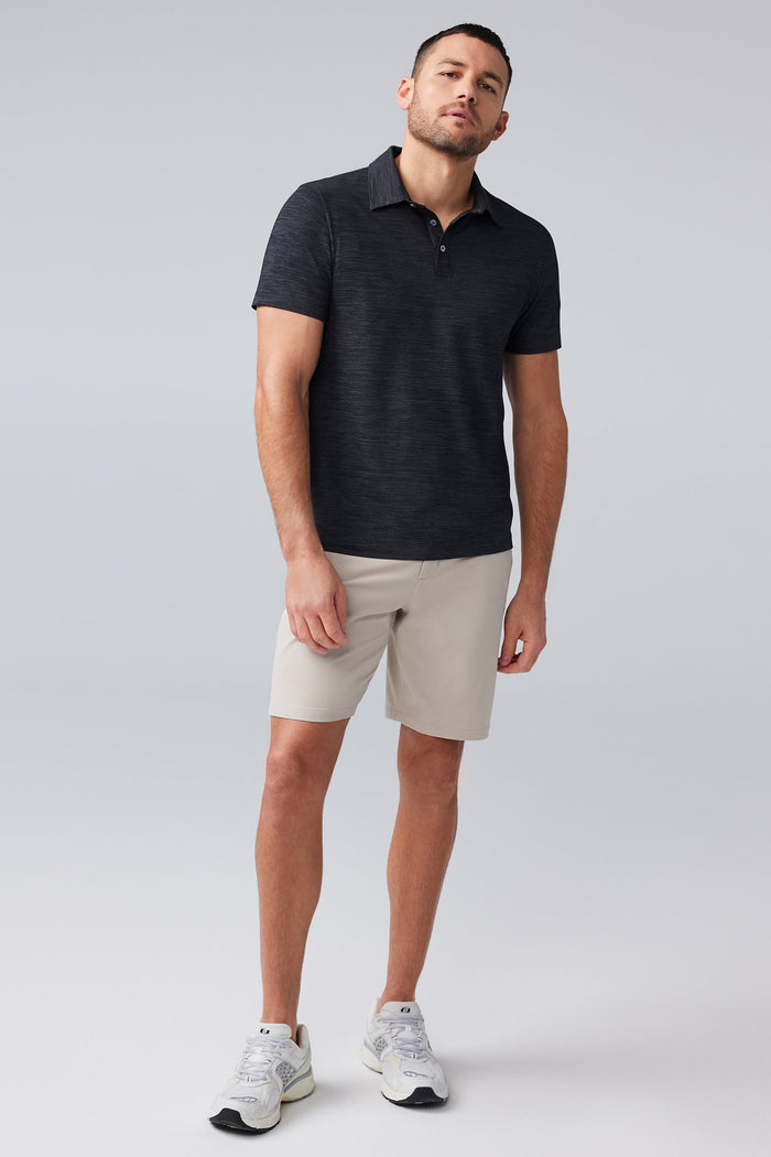 Full body front view of man wearing AIRKNITˣ Polo in Anthracite Gargoyle