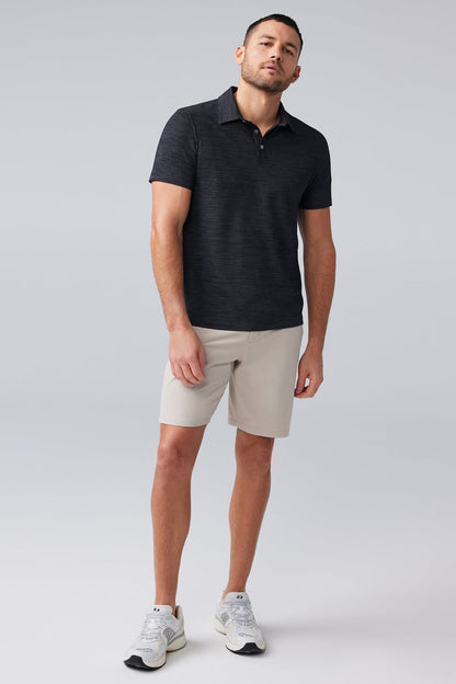 Full body front view of man wearing AIRKNITˣ Polo in Anthracite Gargoyle