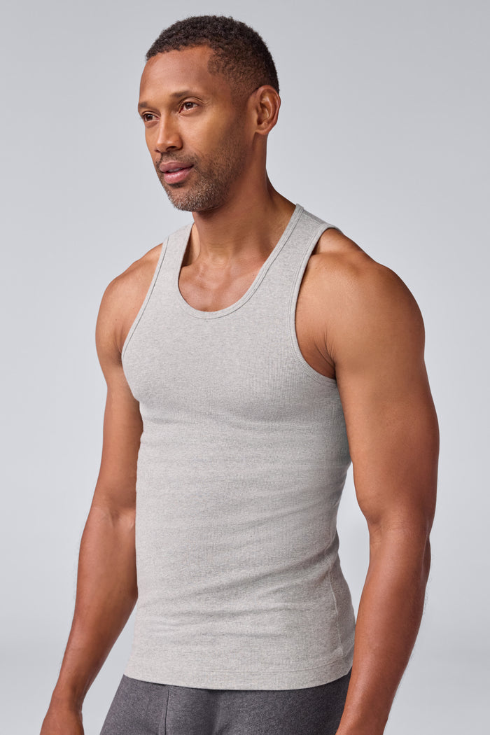 Side view of a man wearing 18-Hour Rib Tank in Grey Heather