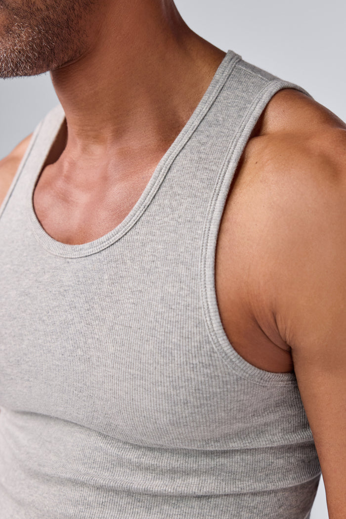 Detailed view of a man wearing 18-Hour Rib Tank in Grey Heather