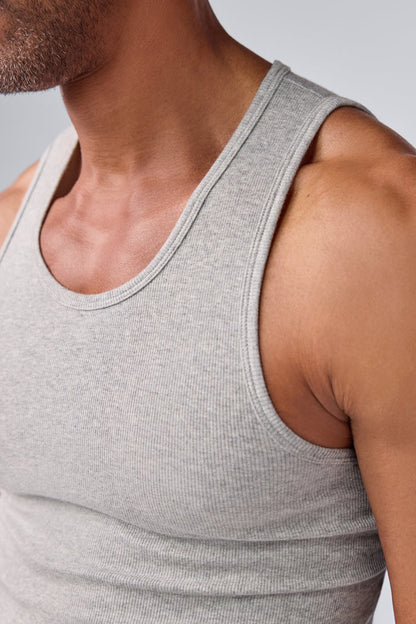 Detailed view of a man wearing 18-Hour Rib Tank in Grey Heather
