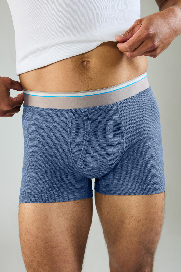 Front view of a man wearing Airknitx Boxer Brief w/ Fly in Indigo Heather