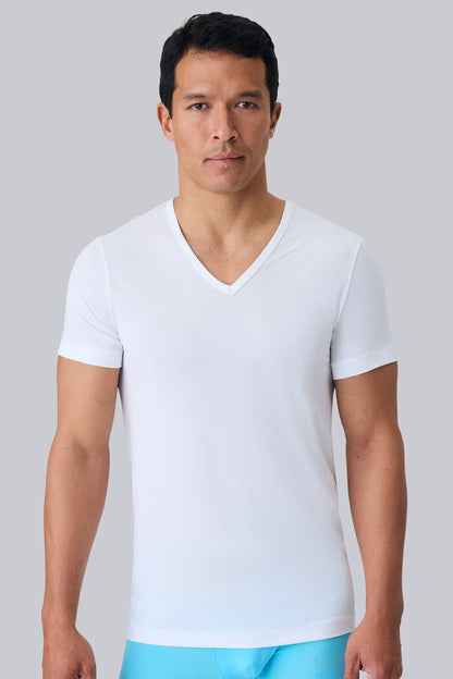 Front view of a man wearing AIRKNITˣ V-Neck Undershirt in Bright White