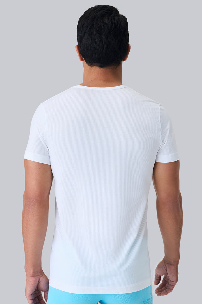 Back view of a man wearing AIRKNITˣ V-Neck Undershirt in Bright White