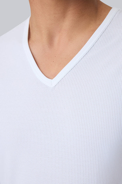 Detailed front view of a man wearing AIRKNITˣ V-Neck Undershirt in Bright White
#ab-second-image