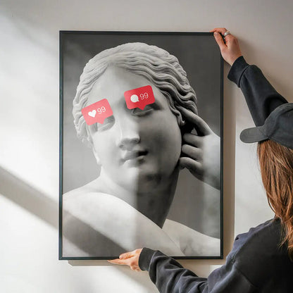 99 Problems Statue Print being hung on a wall in a black frame