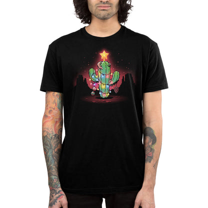 Premium Cotton T-shirt_TeeTurtle A Desert Christmas Black apparel featuring an artistic cactus with lights, ornaments, a star, and a gecko on top in front of a grand canyon inspired silhouetted background.
