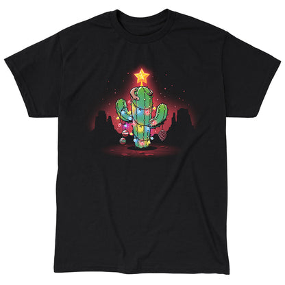 Classic Cotton T-shirt_TeeTurtle A Desert Christmas Black apparel featuring an artistic cactus with lights, ornaments, a star, and a gecko on top in front of a grand canyon inspired silhouetted background.
