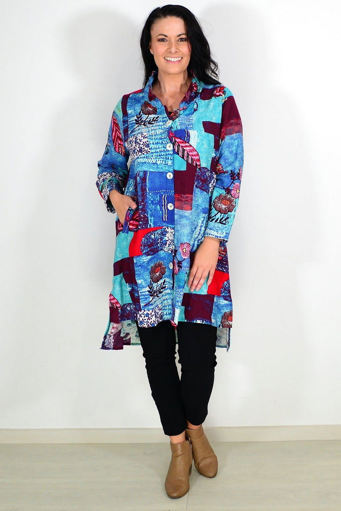 Abstract blue wishstone tunic shirt with flowing fabric and relaxed fit, displayed on a mannequin.
