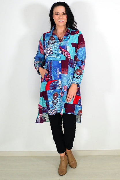 Abstract blue wishstone tunic shirt with flowing fabric and relaxed fit, displayed on a mannequin.