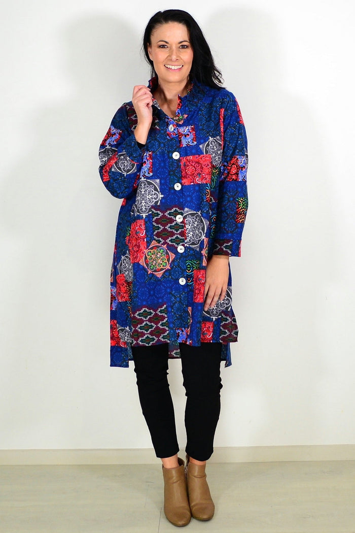 Abstract navy tunic shirt by Wishstone, featuring a stylish design and comfortable fit, displayed on a hanger against a plain background.