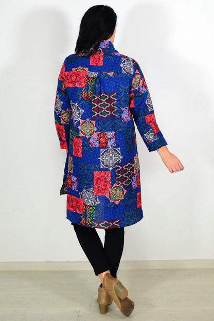 Abstract navy tunic shirt from wishstone, featuring a relaxed fit and stylish design, displayed on a hanger against a neutral background.