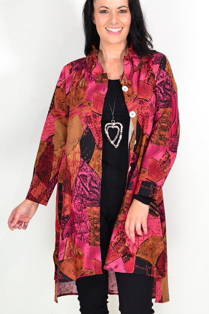 Abstract pink and mustard tunic shirt by Wishstone, featuring a stylish, flowy design perfect for casual or semi-formal wear.