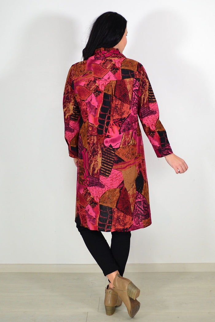 Pink and mustard abstract pattern tunic shirt from wishstone, featuring a relaxed fit and stylish design.