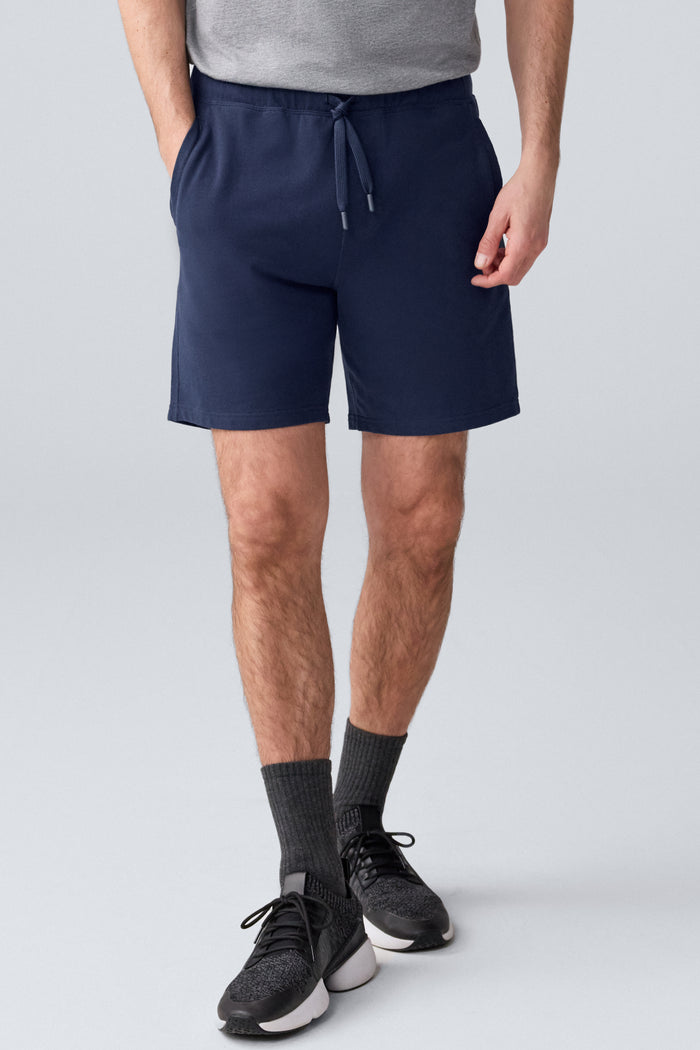 Front view of a man wearing ACE Sweatshort 7” in Total Eclipse