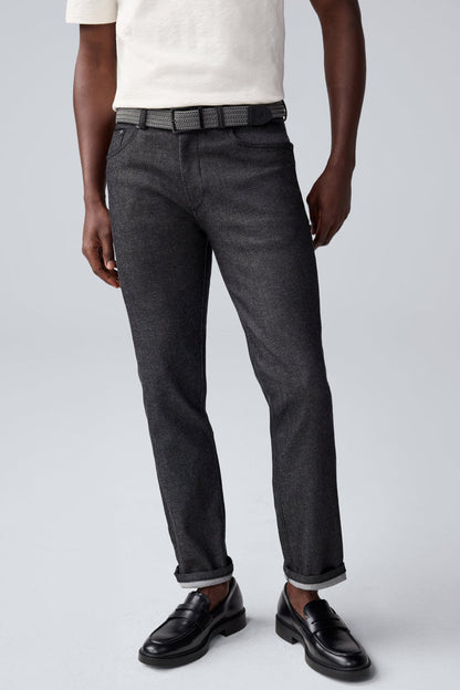 Full view of a man wearing Admiral Braided Belt in True Black / Steel