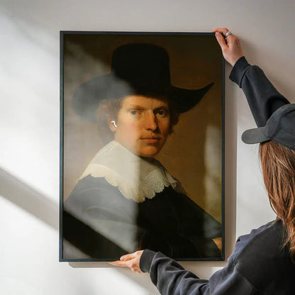 Airpods Portrait Altered Art Print being hung on a wall in a black frame