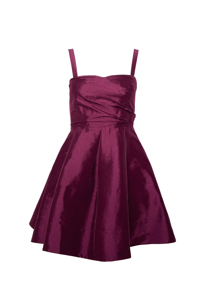 The Ivy City Co Alexis Dress in Wine is a sleeveless, shiny magenta taffeta dress featuring a fitted bodice, thin shoulder straps, and a flared pleated skirt—perfect for any cocktail party.