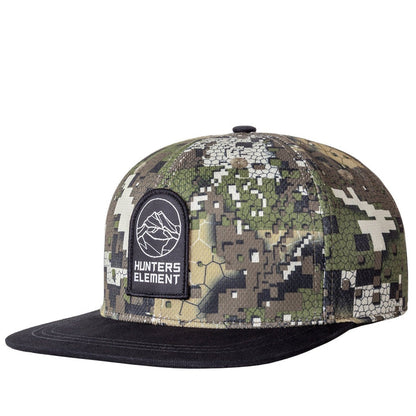 A camouflage patterned snapback cap with a flat peak and a logo on the front.