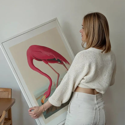 American Flamingo Vintage Antique Bird Print held up against a living room wall