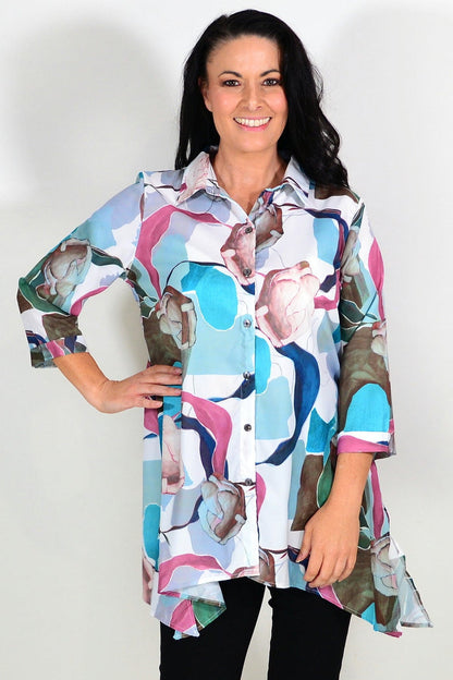 Wishstone Aqua Artwork Swirls Tunic Shirt featuring vibrant blue and white abstract swirl pattern, lightweight and comfortable fit.