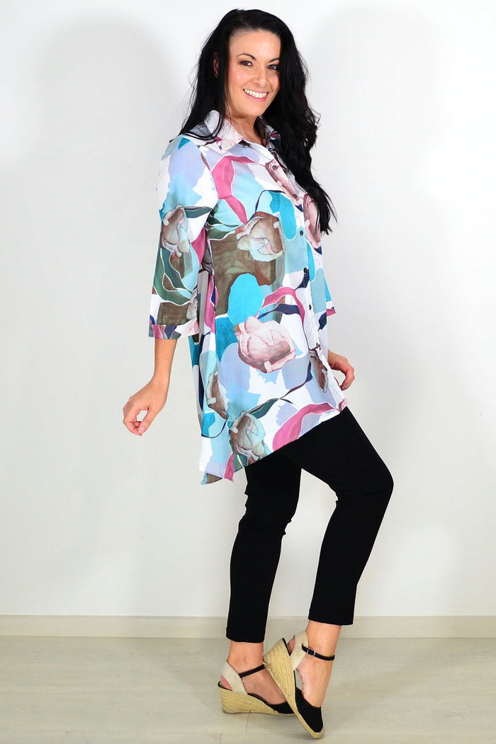 Wishstone Aqua Artwork Swirls Tunic Shirt featuring vibrant swirling blue and aqua patterns, casual fit, and lightweight fabric.