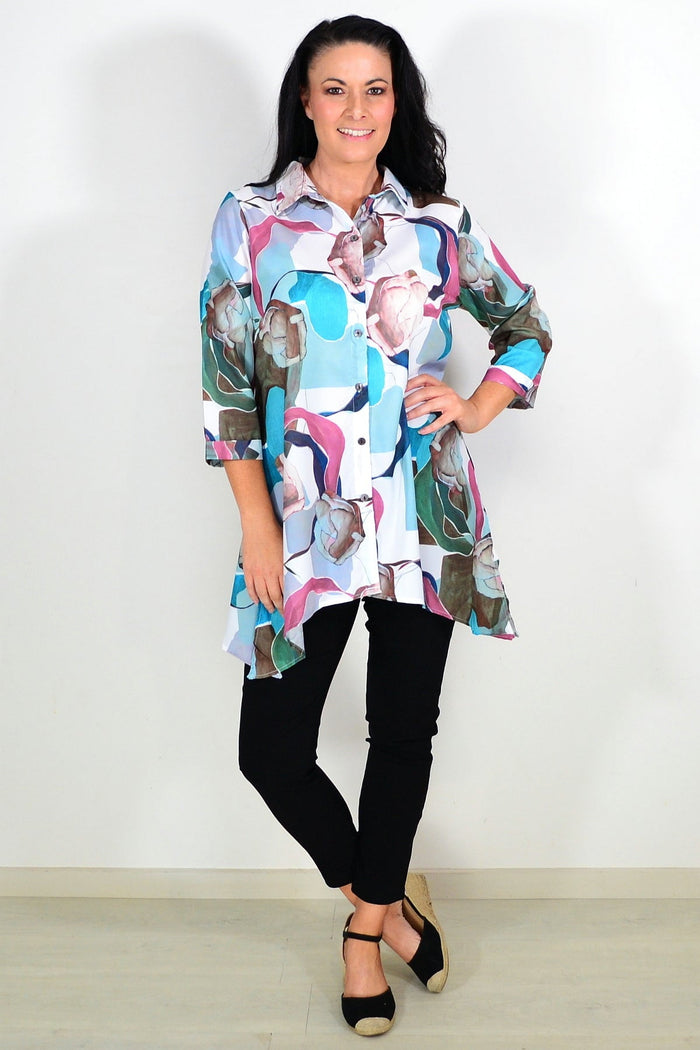 Wishstone Aqua Artwork Swirls Tunic Shirt featuring vibrant swirl designs and a flowing, comfortable fit for casual wear.