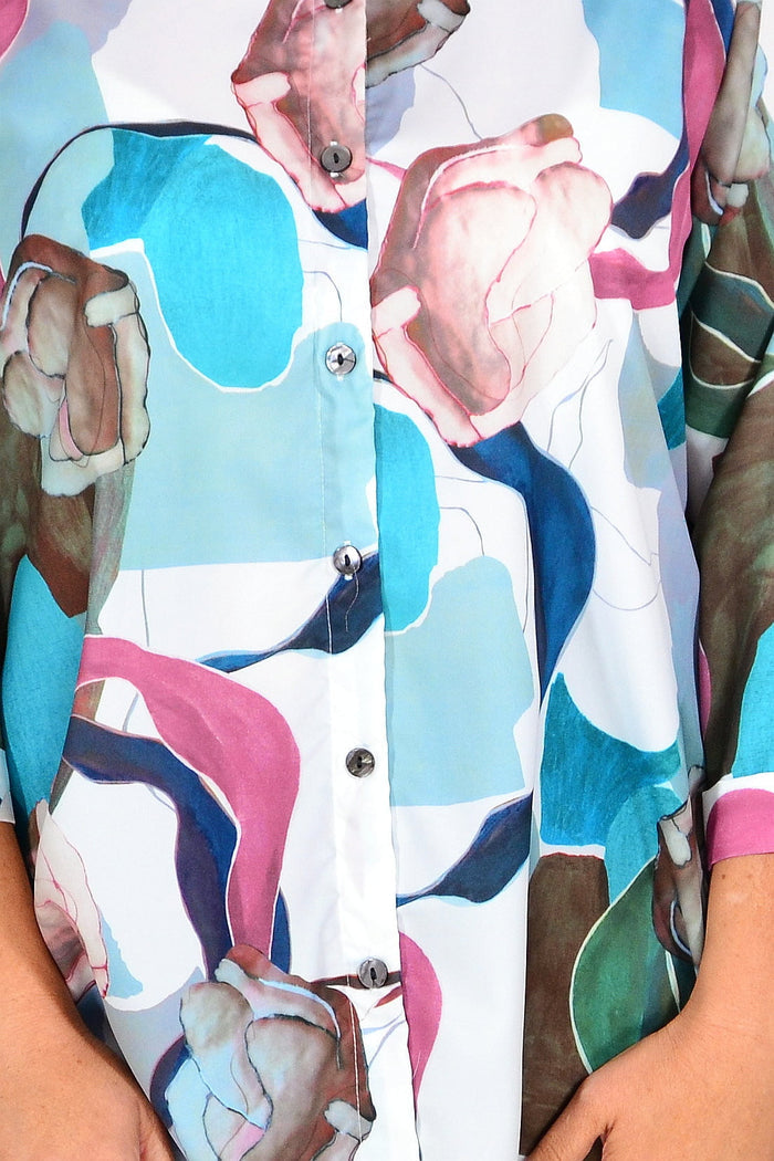 Wishstone Aqua Artwork Swirls tunic shirt with vibrant blue and white swirl patterns, lightweight and casual for everyday wear.