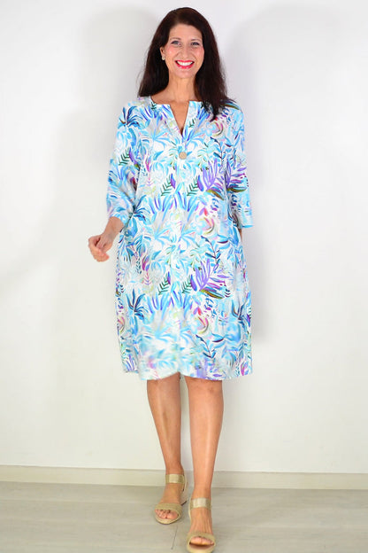 Aqua blue floral linen blend tunic by La Mode, featuring a relaxed fit with vibrant floral patterns and lightweight fabric.