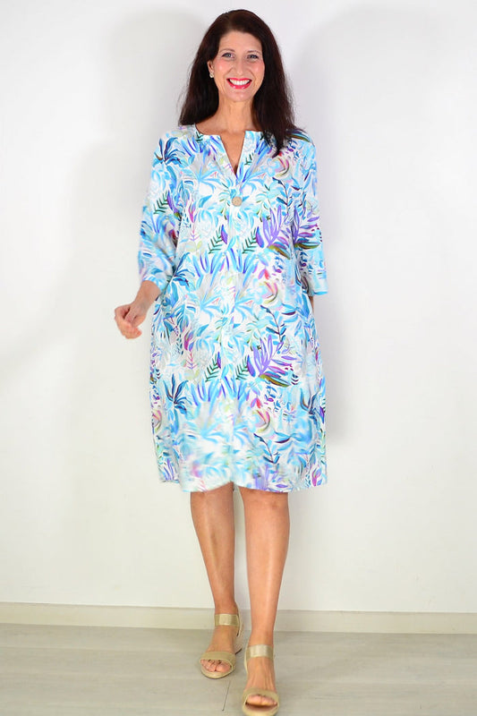 Aqua blue floral linen blend tunic by La Mode, featuring a relaxed fit with vibrant floral patterns and lightweight fabric.