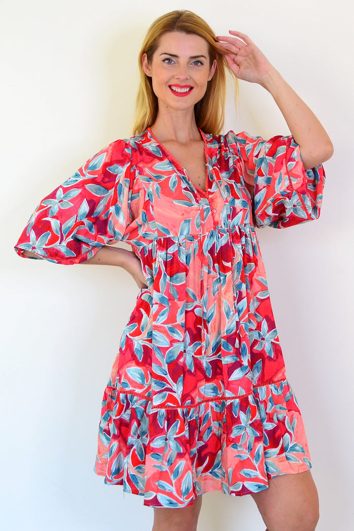 Dream Aqua Coral floral bohemian tunic dress with flowing fabric and vibrant floral patterns, perfect for casual or beachwear.