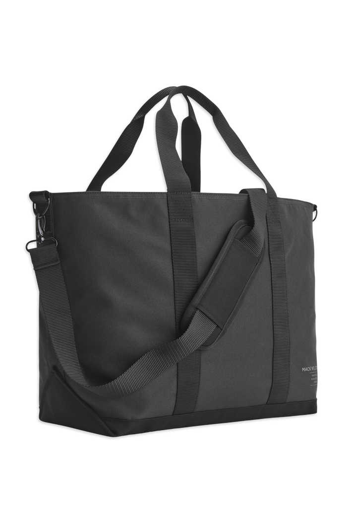 Front side view of the Atlas Tote showcasing the carrying handles and shoulder strap