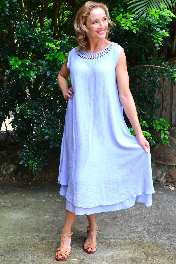Baby blue Grecian sleeveless tunic dress by La Mode, featuring flowing fabric and a classic draped design.