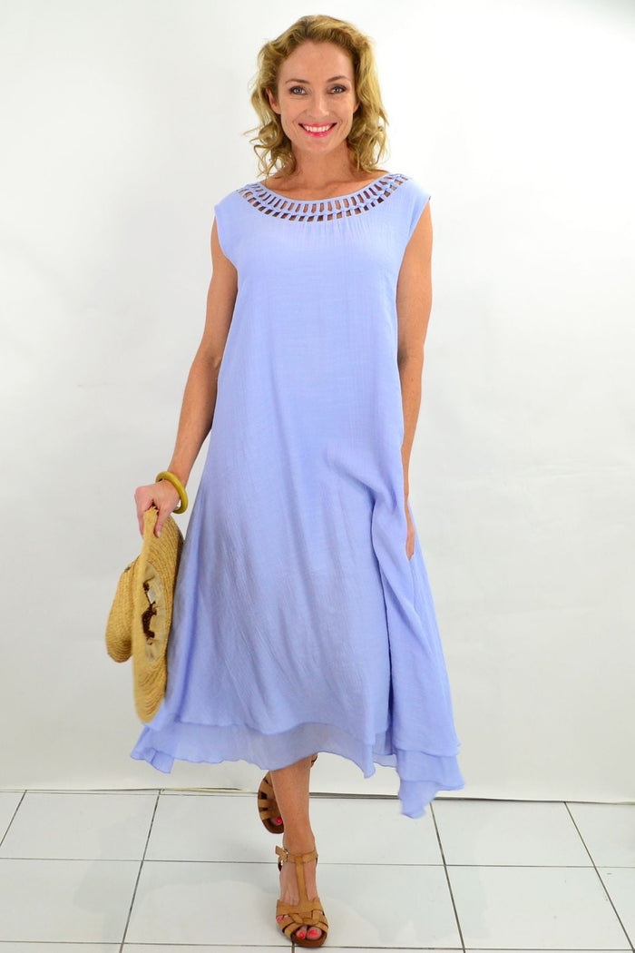 Baby blue Grecian sleeveless tunic dress by La Mode, featuring flowing fabric and elegant drape, worn as a stylish summer outfit.