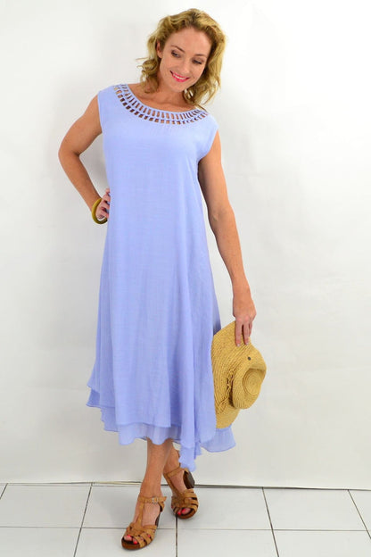 Baby blue Grecian sleeveless tunic dress by La Mode, featuring flowing fabric and elegant drape on a mannequin.
