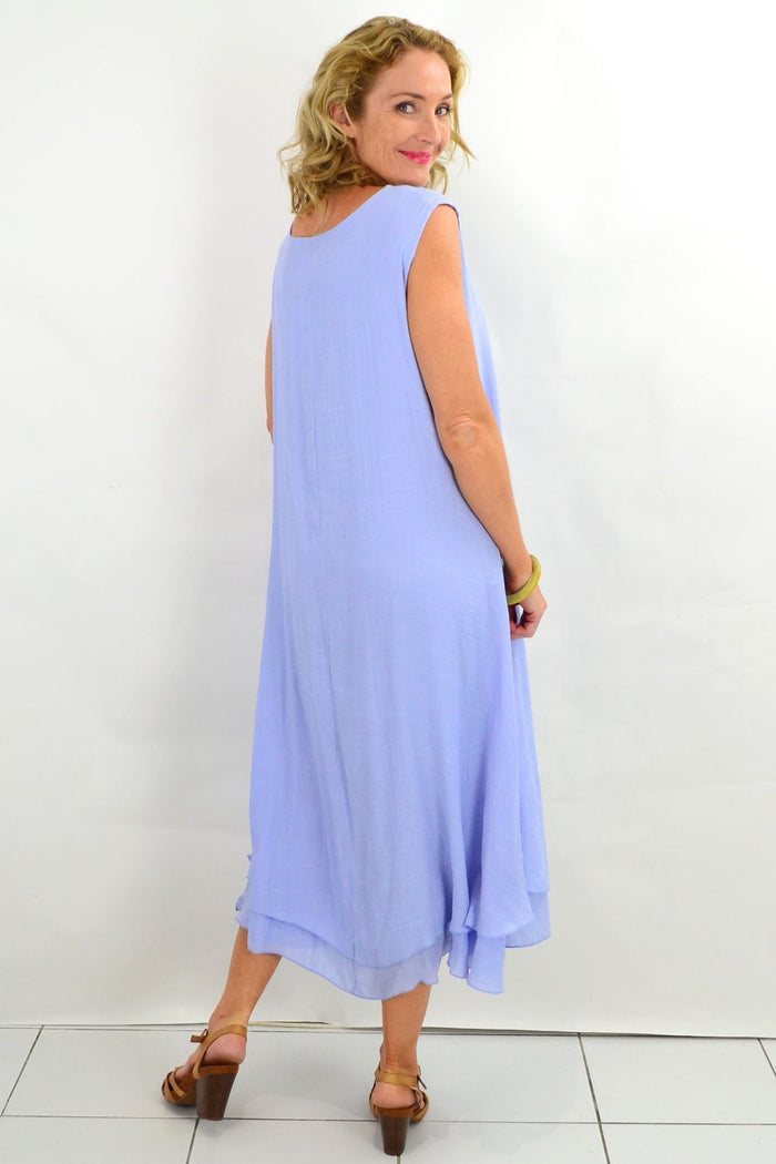 Baby blue Grecian sleeveless tunic dress by La Mode, flowing fabric with draped design, perfect for warm weather.