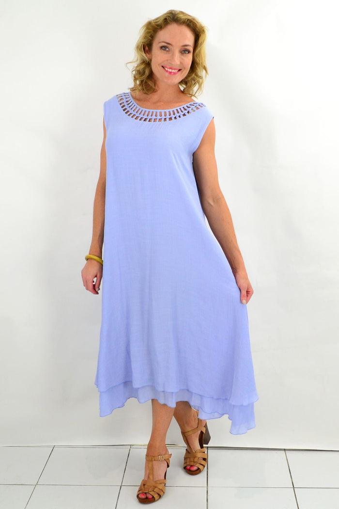 Baby blue La Mode Grecian sleeveless tunic dress with draped fabric and flowing silhouette, displayed on a mannequin.