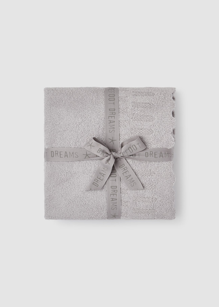 Grey blanket folded and wrapped with a grey bow