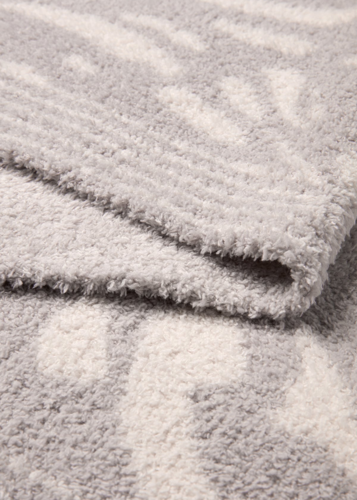 Grey and cream animal print blanket